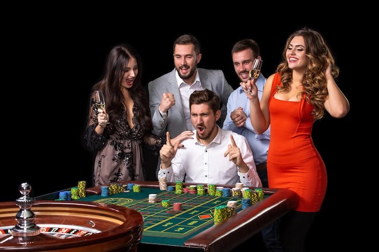 Live baccarat dealer at gaming table